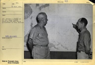 Admiral Chester W. Nimitz and Lieutenant Colonel James Patrick Devereaux Look Over Map at Headquarters on Guam, Marianas