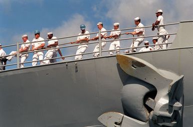 The deck crew of the USS MISSOURI (BB-63) handles the mooring lines as the battleship arrives in port on Survivor's Day, when the sailors and Marines of the battleships that were sunk or damaged in the Dec. 7, 1941, attack on Pearl Harbor are honored. The battleship, the last of its kind in commission, is deployed to help commemorate the 50th anniversary of the bombing