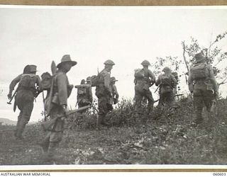 SATTELBERG AREA, NEW GUINEA. 1943-11-17. TROOPS OF THE 2/48TH AUSTRALIAN INFANTRY BATTALION READY TO MOVE OVER THE TOP TO ATTACK JAPANESE POSITIONS AT SATTELBERG