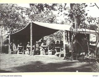 SIAR, NEW GUINEA. 1944-06-25. TROOPS OF THE 57/60TH INFANTRY BATTALION RELAXING IN THEIR RECREATION TENT