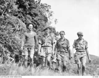 1942-10-19. FOUR MEN OF AN A.I.F. UNIT RETURNED FROM THE MIDDLE EAST WHO ARE NOW IN ACTION ON THE KOKODA FRONT, THEY ARE:- PTE. F.W. LEE; PTE J.E. CLEASBY AND PTE. E.A. ELVY. (NEGATIVE BY PARER)