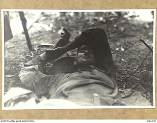 CANNING SADDLE, NEW GUINEA. 1944-01-22. WOUNDED OF THE 2/12TH INFANTRY BATTALION RECEIVING TREATMENT AT CHEN'S POST ON CANNINGS SADDLE AFTER THE SUCCESSFUL ATTACK ON THE ENEMY POSITIONS IN THE AREA