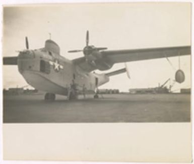 [Jerry Michaud and another serviceman posing with Martin PBM Mariner]