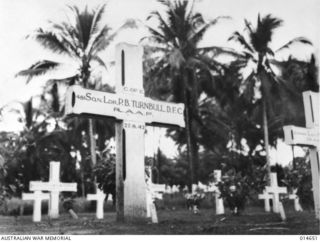 MILNE BAY, NEW GUINEA, 1943-04-14. THE GRAVE OF SQUADRON LEADER P.B. TURNBULL, DFC. IN THE MILNE BAY WAR CEMETERY. SQUADRON LEADER TURNBULL, THE COMMANDING OFFICER OF NO 76 SQUADRON, WAS KILLED ..