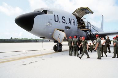 Ground crew members prepare to unload cargo from a KC-135 Stratotanker aircraft. The aircraft, assigned to the 28th bomb Wing, is participating in Exercise Glad Customer '82