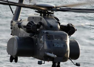 A view from on board the US Navy (USN) Tarawa Class Amphibious Assault Ship, USS USS SAIPAN (LHA 2), showing a US Marine Corps (USMC) MH-53E Sea Stallion helicopter, assigned to Helicopter Mine Countermeasure Squadron 14 (HM-14), approaching to land while the ship is underway in the Atlantic Ocean, conducting qualifications of its upcoming deployment