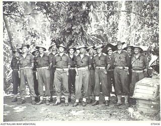 WEBER POINT, NEW GUINEA, 1944-02-14. OFFICERS OF HEADQUARTERS 8TH INFANTRY BRIGADE. IDENTIFIED PERSONNEL ARE: NX118443 LIEUTENANT W.E. LETTON, SIGNAL OFFICER (1); NX76311 CAPTAIN D.D. NATHAN, ..