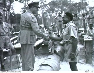 THE SOLOMON ISLANDS, 1945-01-12. A NATIVE PRIZE WINNER AT A COMBINED ANZAC SPORTS MEETING AT BOUGAINVILLE ISLAND. (RNZAF OFFICIAL PHOTOGRAPH.)