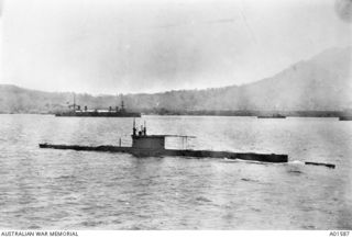 The Australian submarine AE2 in Rabaul Harbour.  Two other ships are seen in the background.  AE2 was sunk in the Sea of Marmora on 30 April 1915