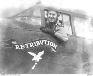 250430 Squadron Leader (Sqd Ldr) Kenneth Roy McDonald of No 22 Squadron RAAF, in the cockpit of his Boston Aircraft named Retribution. Sqn Ldr McDonald was killed in aerial combat over New Guinea ..