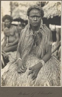 Widow of Vilirupu [woman wearing grass shawl, skirt and beaded jewellery] Frank Hurley