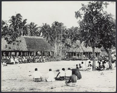 People meeting in a Samoan village.