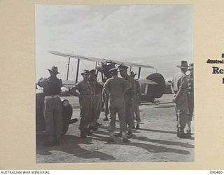 JACQUINOT BAY, NEW BRITAIN. 1945-04-09. SENATOR J.M. FRASER, ACTING MINISTER FOR THE ARMY (1), AT THE RAAF AIRSTRIP BUILT BY 5 DIVISION PERSONNEL. THE SENATOR IS ABOUT TO DEPART FROM THE AREA