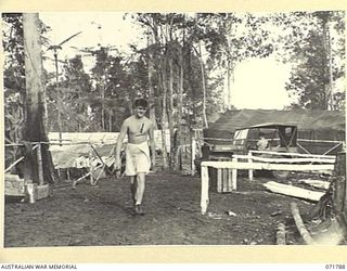 WAREO, PAPUA, NEW GUINEA, 1944-03-29. VX106541 PRIVATE A. N. NOBLE (1), AT THE HEADQUARTERS OF B COMPANY, 4TH FIELD AMBULANCE REST CAMP