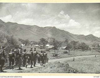 FINISTERRE RANGES, NEW GUINEA, 1944-03-15. TROOPS OF THE 2/10TH INFANTRY BATTALION ON THE MARCH FROM THE EVAPIA RIVER TO KESAWAI TO TAKE UP NEW POSITIONS IN THE FINISTERRE RANGES