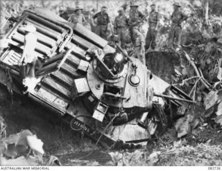 MADANG, NEW GUINEA. 1944-10-12. THE COMMENCEMENT OF RECOVERY OPERATIONS OF A MATILDA TANK FROM A CREEK BED DURING TESTS CONDUCTED AT HQ 4 ARMOURED BRIGADE