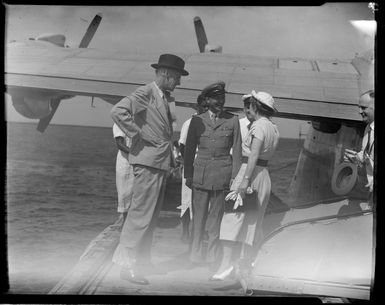 Tasman Empire Airways Ltd, courtesy flight, Governor of Fiji, Sir Leslie [Brian?], Freeston, his wife, and the [flying boat captain?], Suva, Fiji,