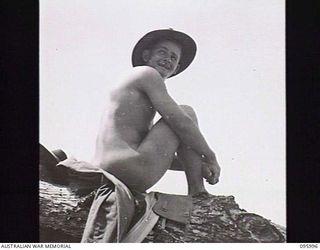 WEST WEWAK BEACH, NEW GUINEA. 1945-09-01. PRIVATE E. MORTLOCK, 2/8 INFANTRY BATTALION ON THE BEACH