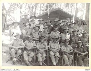 TOROKINA, BOUGAINVILLE. 1945-05-31. SERGEANT S. DUBOIS (1) AND MEMBERS OF ROYAL AUSTRALIAN ARTILLERY HEADQUARTERS 2 CORPS STAFF