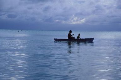 Canoes sailing