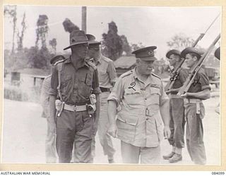 TOROKINA AREA, BOUGAINVILLE, 1944-12-10. GENERAL SIR THOMAS BLAMEY, COMMANDER- IN- CHIEF, ALLIED FORCES, SOUTH WEST PACIFIC AAREA, (2), ACCOMPANIED BY LIEUTENANT E. BROWNING, (1), INSPECTS THE ..