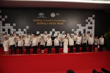 Barack Obama joins Asia Pacific Economic Cooperation Summit leaders and spouses for a group photo in Pasay, Metro Manila, Philippines, November 18, 2015