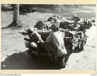 1943-01-08. STRETCHER CASES BEING TAKEN TO THE BASE BY JEEP, ONE OF MANY TO WHICH THESE SPLENDID LIGHT CARS HAVE BEEN PUT IN NEW GUINEA. (NEGATIVE BY G. SILK)