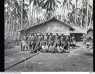 GUADALCANAL, BRITISH SOLOMON ISLANDS PROTECTORATE. 1944-01-25. GROUP PORTRAIT OF LOCAL NATIVE HEADMEN AND POLICE BOYS HOLDING A PLAQUE TO BE PRESENTED TO THE US NAVY TO COMMEMORATE THE LIBERATION ..