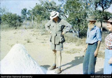 Marie Reay standing with unidentified men