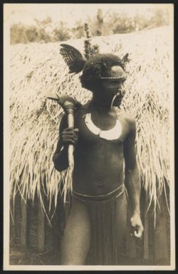 [Native of the Miranei [i.e.Mirani] district holding a stone axe] [Central New Guinea], 1933