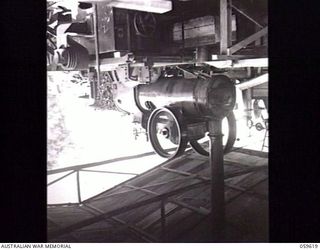 DONADABU, NEW GUINEA. 1943-11-09. ENGINE ROOM OF THE EILOGO SAWMILL WHICH IS OPERATED BY THE 9TH AUSTRALIAN WORKSHOP AND PARK COMPANY, ROYAL AUSTRALIAN ENGINEERS. THE SMALL 'MOSQUITO-BENCH' IN THE ..