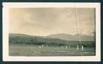 Cricket match, mountain ranges can be seen in background, New Guinea, c1929 to 1932