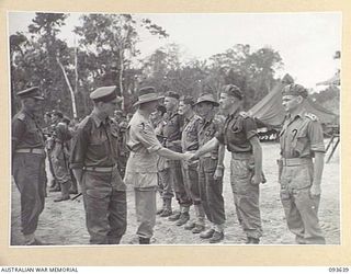 HONGORAI RIVER, BOUGAINVILLE, 1945-07-04. HIS ROYAL HIGHNESS, THE DUKE OF GLOUCESTER, GOVERNOR-GENERAL OF AUSTRALIA (2), BEING INTRODUCED TO OFFICERS OF HEADQUARTERS 3 DIVISION DURING HIS VISIT TO ..