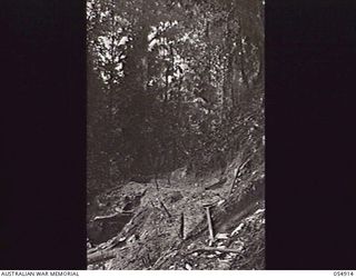 BULLDOG-WAU ROAD, NEW GUINEA, 1943-07-14. PARTLY CONSTRUCTED ROAD SECTION AT THE 21 AND A HALF MILE POINT