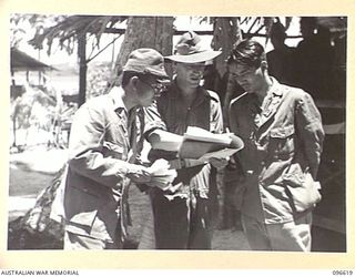 BONIS PENINSULA, BOUGAINVILLE. 1945-09-15. DURING SURRENDER DISCUSSIONS AT JAPANESE NAVAL HEADQUARTERS, BONIS PENINSULA BY THE AUSTRALIAN SURRENDER PARTY, MEMBERS OF HEADQUARTERS 2 CORPS, MAJOR ..