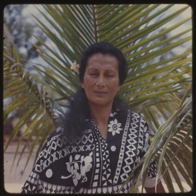 Fijian woman standing in front of a palm tree, Castaway island, Fiji, 1965 / Michael Terry