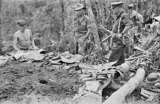 TOROKINA AREA, BOUGAINVILLE ISLAND. 1944-11-30. TX2002 BRIGADIER J. FIELD, DSO, ED, COMMANDING, 7TH INFANTRY BRIGADE (3) CHATTING WITH MEMBERS OF D COMPANY, 9TH INFANTRY BATTALION ON LITTLE GEORGE ..