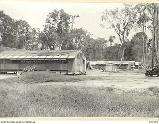 TOROKINA AREA, BOUGAINVILLE ISLAND. 1944-12-01. A SECTION OF THE CAMP AREA OF HEADQUARTERS, 4TH BASE SUB AREA. THE BUILDINGS FROM LEFT TO RIGHT ARE:- "A" AND "Q" BRANCHES, CARPENTERS SHOP, SIGNALS ..