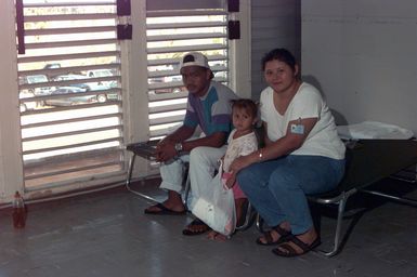 This family has set up their cots in their room at the temporary housing in converted dorms at Andersen Air Force Base south, Guam, after Super Typhoon Paka destroyed or badly damaged their homes